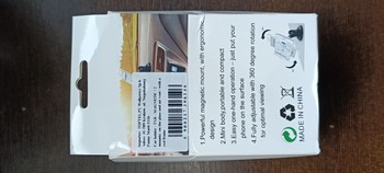 Uchwyt samochodowy - TXR - MAGNETYCZNY /2 mocowania: na szybę i kratkę/ z czerwoną ramką (uszkodzone opakowanie)